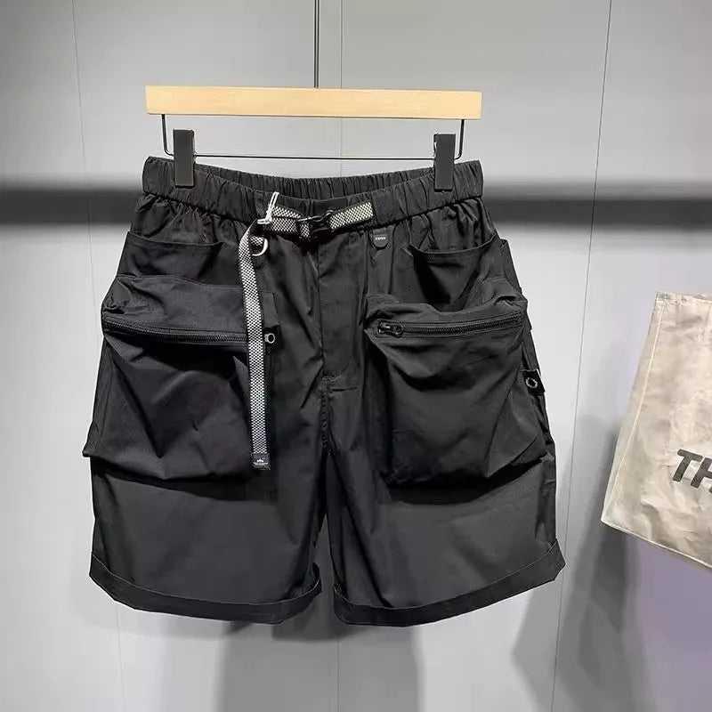 Men's black loose-fitting work shorts with elastic waistband and pockets, laid flat