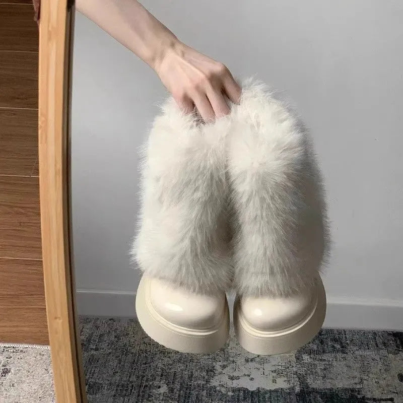 Women's black artificial plush snow boots with a waterproof rubber sole and fleece lining.