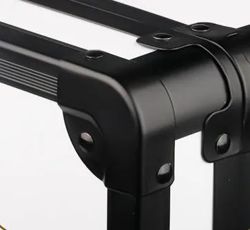 Black PVC suitcase with combination lock for storing hair styling tools, shown with dimensions 55cm by 27cm.