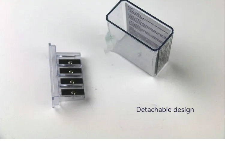 Geometric plastic pencil sharpener with four holes and an included screwdriver tool.