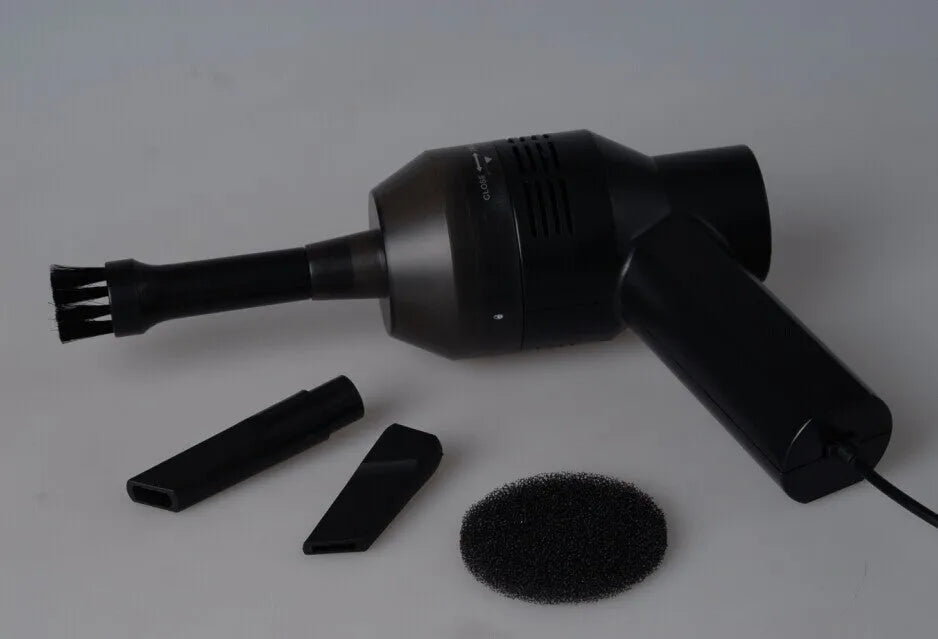 Black desktop mini vacuum cleaner with USB cable for computer keyboard and electronic dust removal
