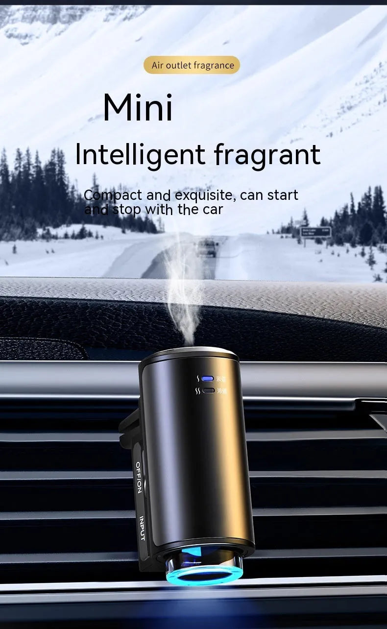 Smart car aroma diffuser clipped onto car air vent in obsidian black colour with essential oil bottles
