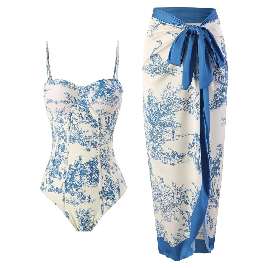 Blue patterned women's one-piece swimsuit with matching gauze skirt shown in multiple size options
