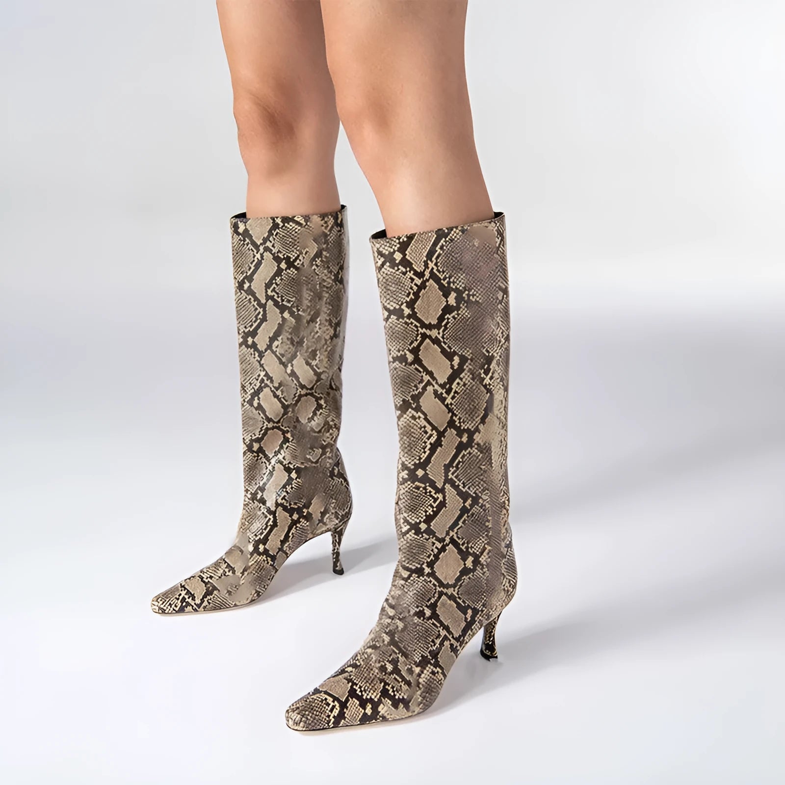 Women's black square toe cowboy boots with a block heel on a white background