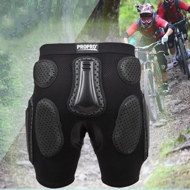 Black cycling hip protection pants with integrated pads, showing hook and loop fastener closures.