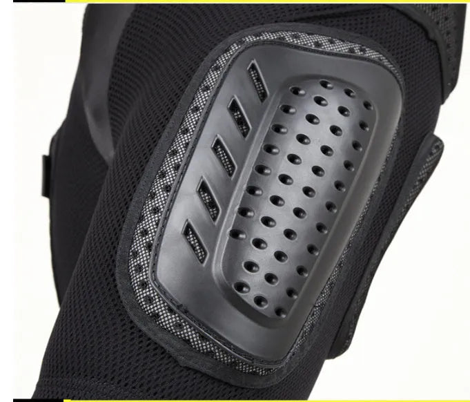 Black cycling hip protection pants with integrated pads, showing hook and loop fastener closures.