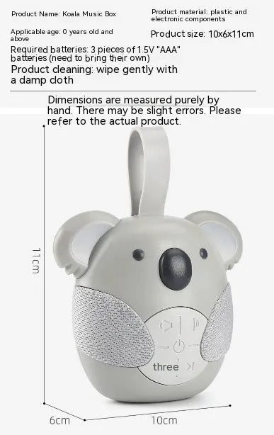 Koala-shaped infant white noise player toy in fox colour on a surface