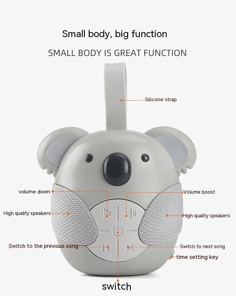 Koala-shaped infant white noise player toy in fox colour on a surface