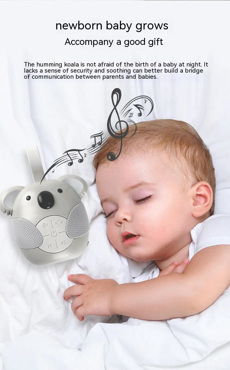 Koala-shaped infant white noise player toy in fox colour on a surface