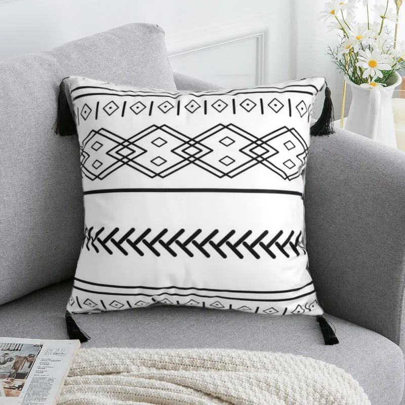 Bohemian national style polyester cushion cover in light grey on a sofa.