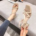 Women's apricot thick heel sandals with a block heel and slip-on sleeve style on a white background.