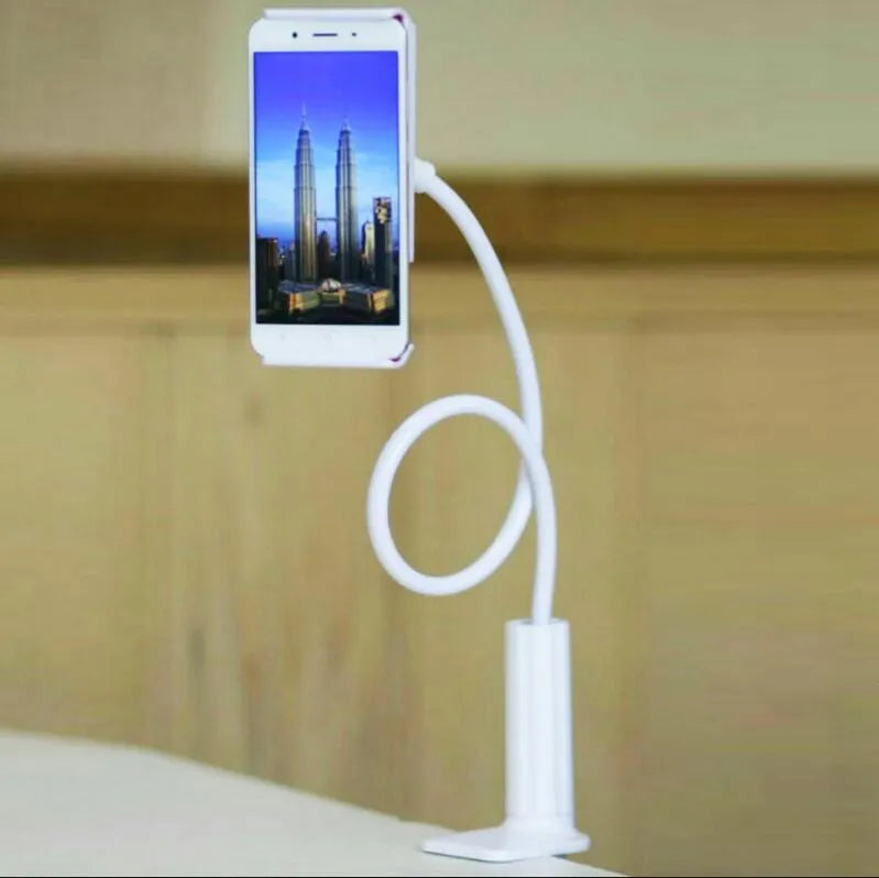 Black bedside phone handset with long adjustable arm and clamp base on a wooden table.