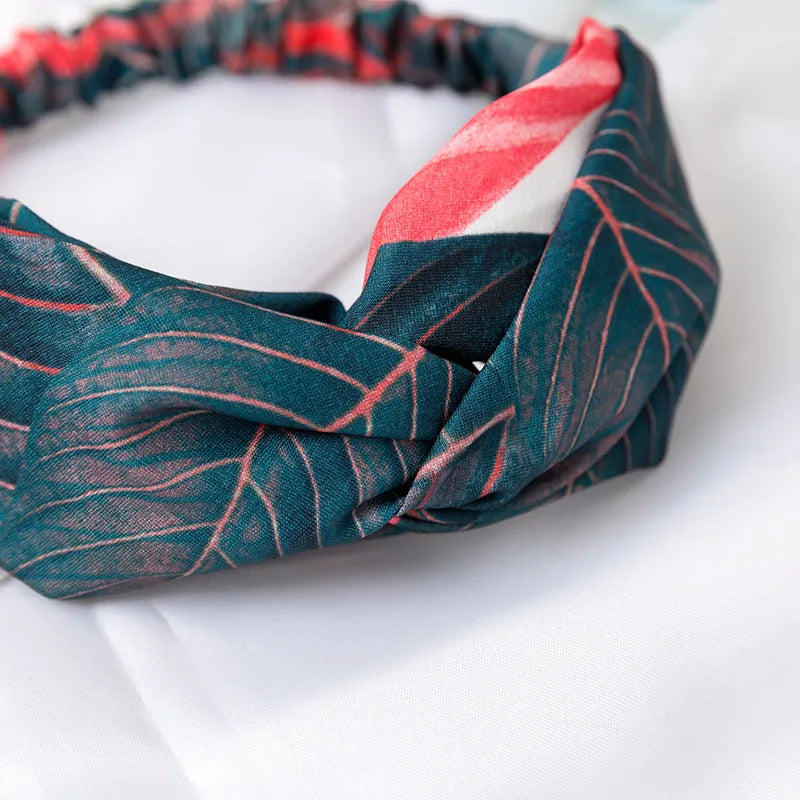 Red cloth headband with banana leaf cross design, elasticated hairband for women