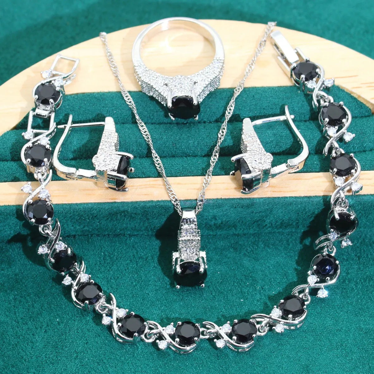 Bridal zircon necklace, bracelet, earrings, and ring four-piece jewellery set in alloy.
