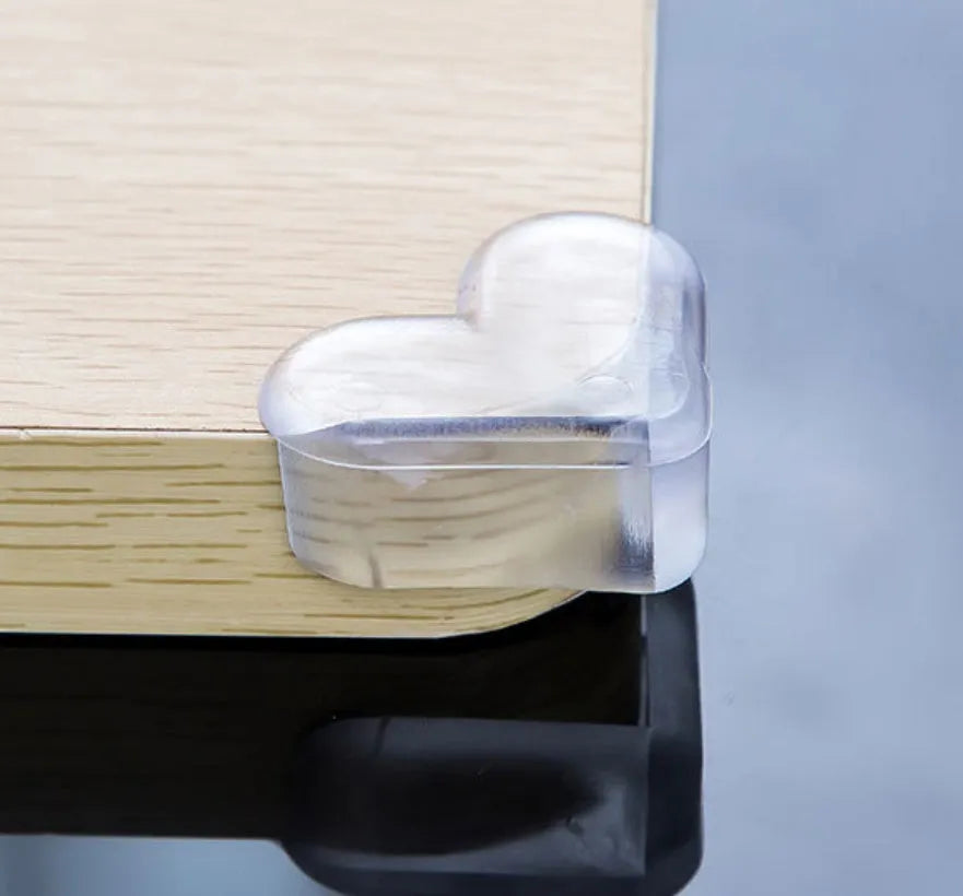 Heart-shaped PVC anti-collision baby safety corner protector on furniture edge, 5cm x 4cm x 2cm