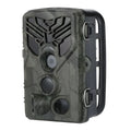 Wifi830 wireless trail camera with camouflage design on tree branch, showing compact size and infrared LEDs.