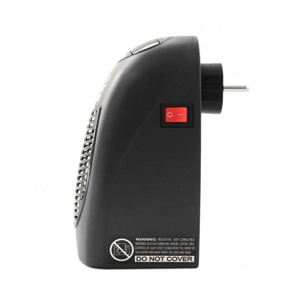 Black compact ceramic electric heater with digital display and rotating plug on a desk.