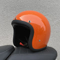 Retro-style open-face motorcycle half helmet in cement grey with a glossy FRP shell and quick-release chin strap.