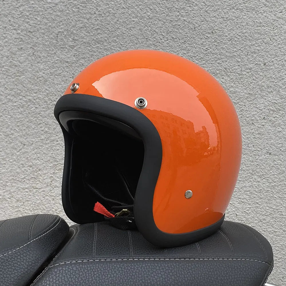 Retro-style open-face motorcycle half helmet in cement grey with a glossy FRP shell and quick-release chin strap.