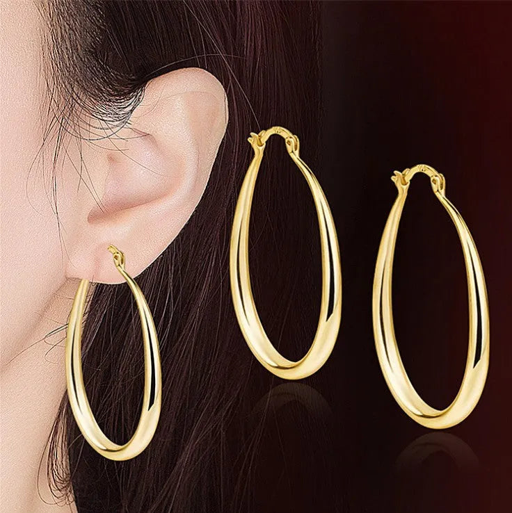 Geometric oval metal earrings for women with electroplated finish and alloy inlaid gems in gold and silver