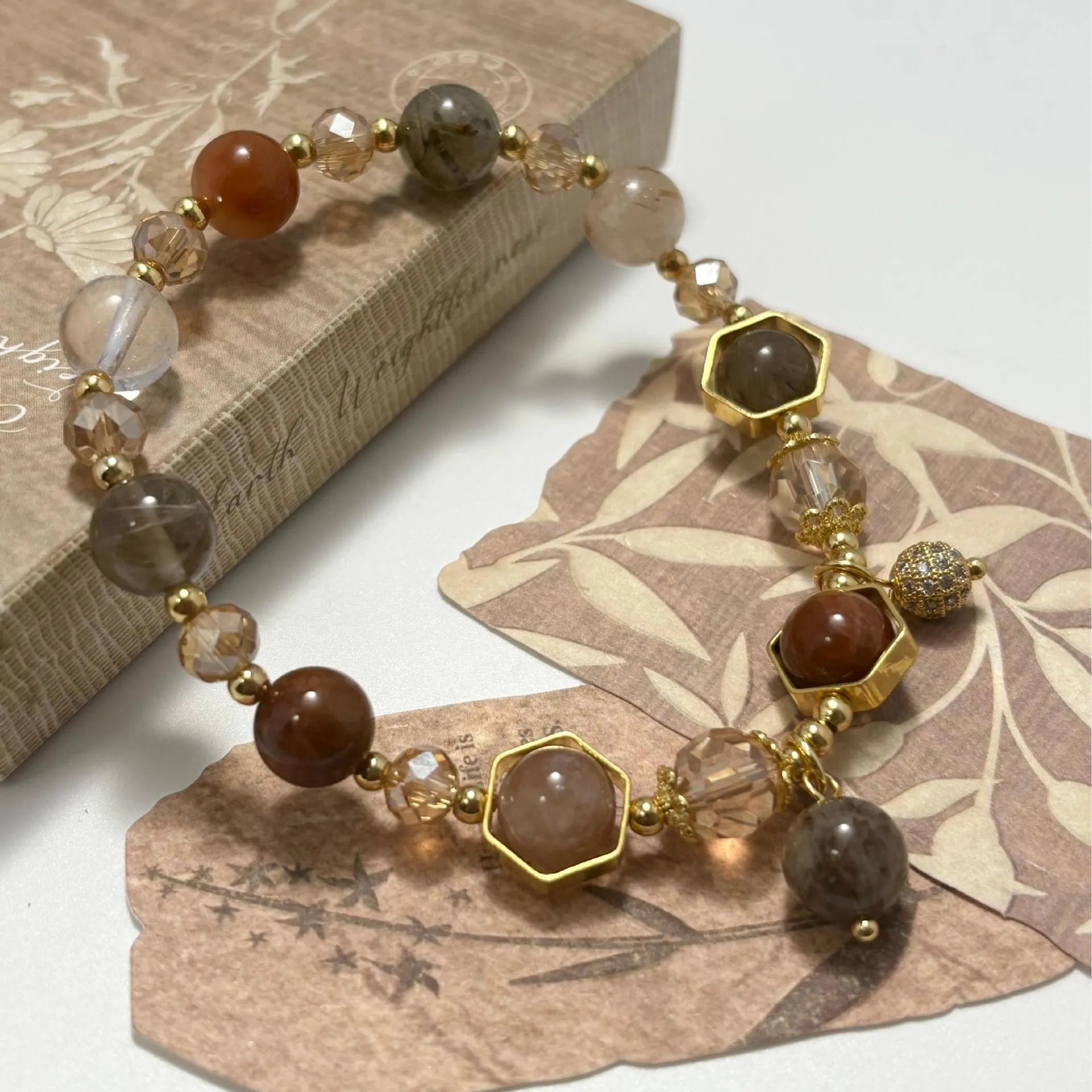 Gold-coloured crystal bracelet with auspicious symbols and 8mm constellation modelling
