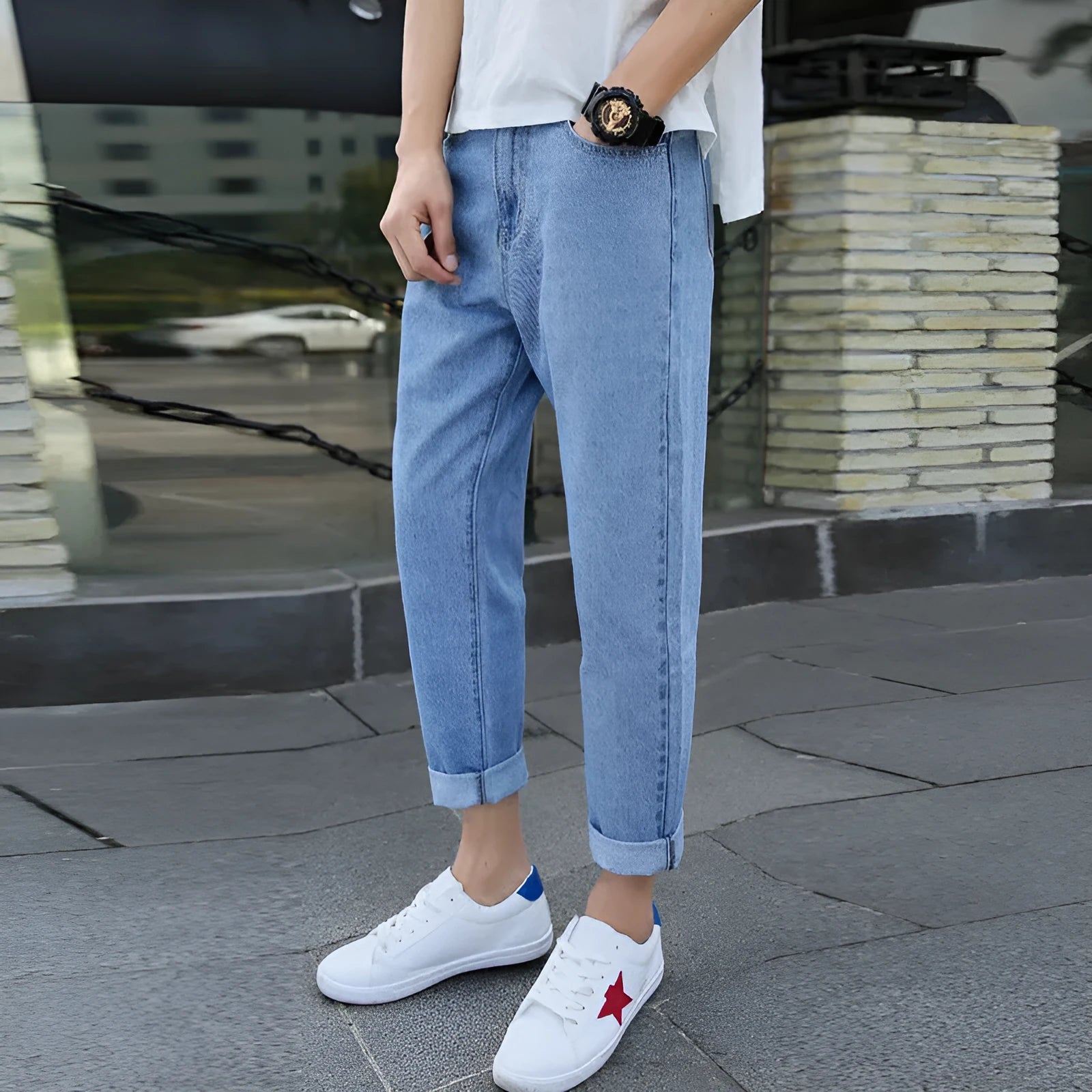 Men's loose straight-leg high-waisted harem jeans in black, laid flat.