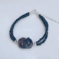 Hand-carved obsidian bracelet with cat climbing design in natural K2 cold obsidian stone
