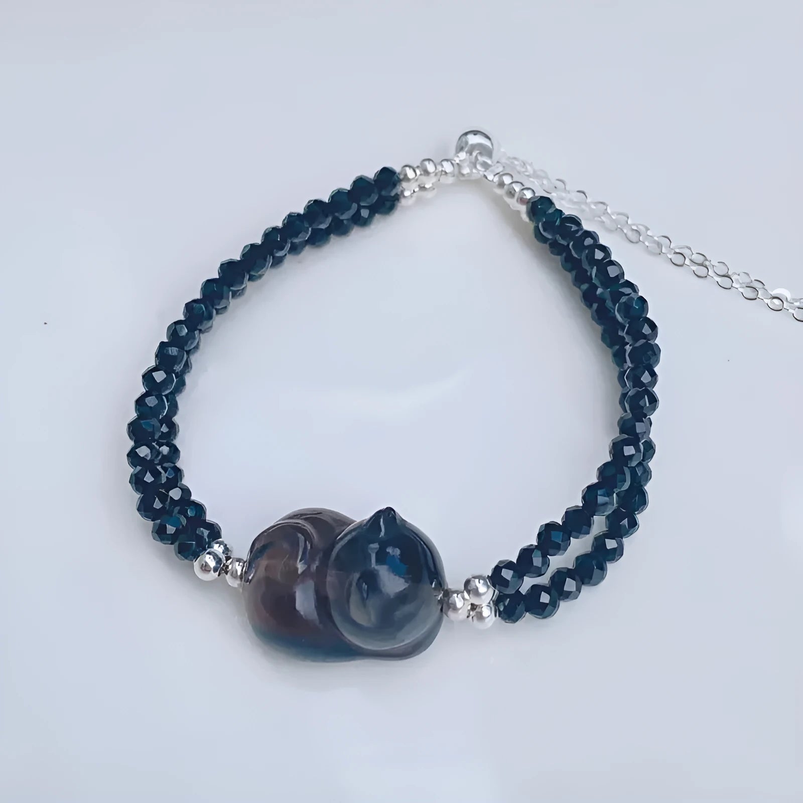Hand-carved obsidian bracelet with cat climbing design in natural K2 cold obsidian stone