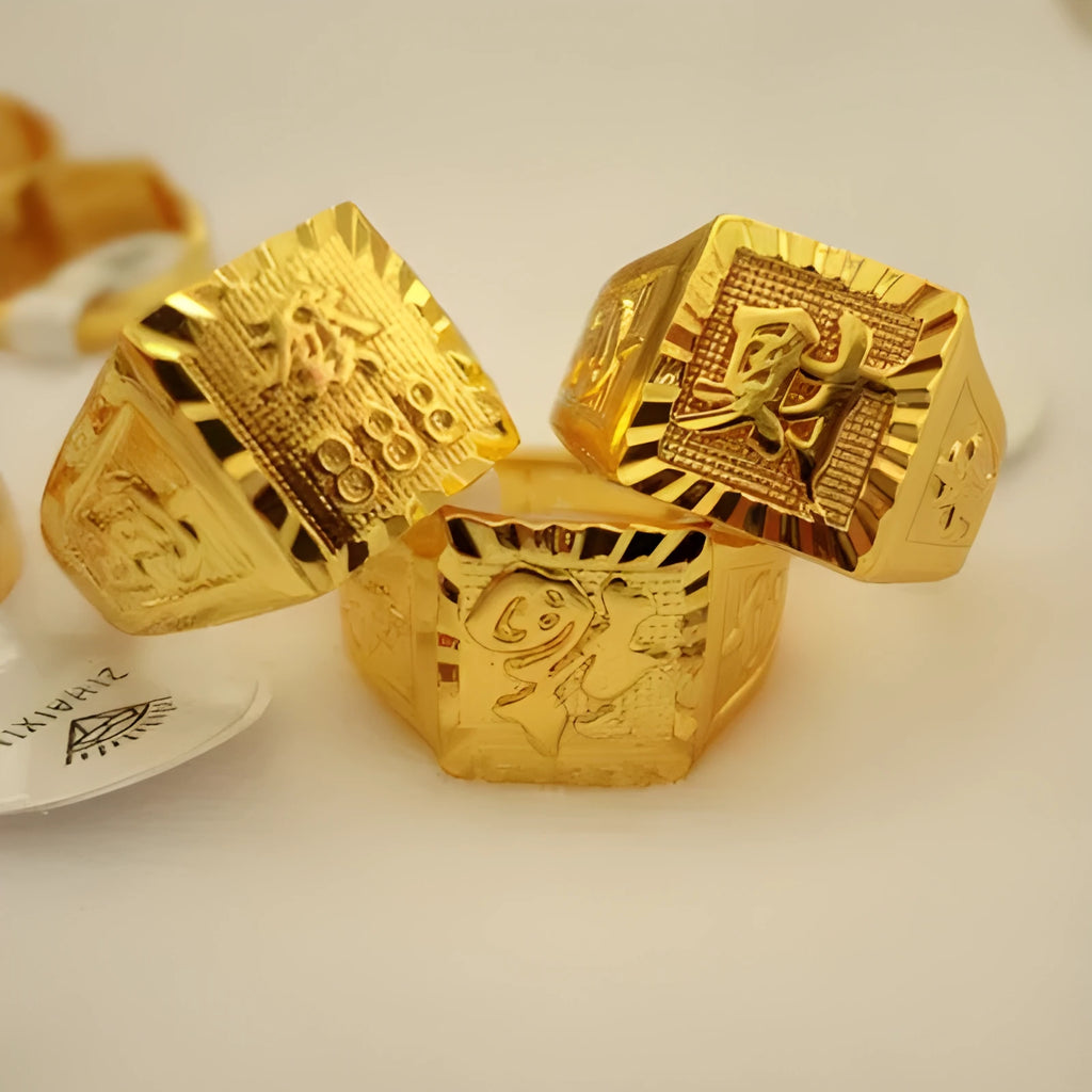 Square men's alloy ring with electroplated yellow finish on plain background