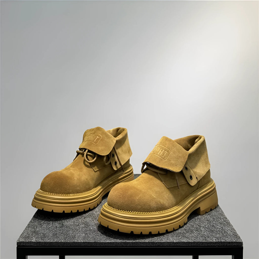 Retro distressed suede work boots with thick soles and sewing line detailing in camel colour