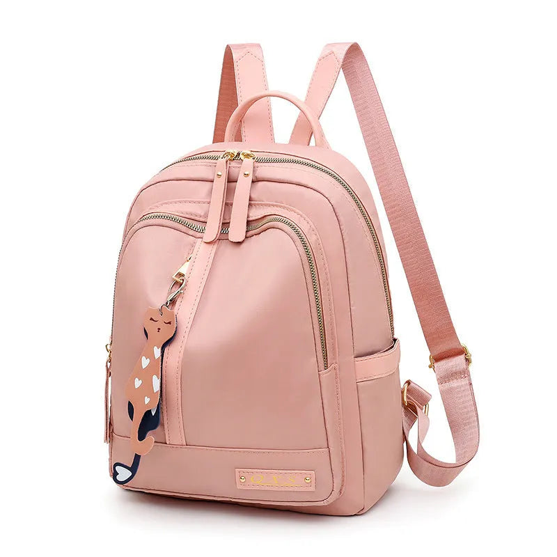 Women's black nylon backpack with anti-theft pockets and water-resistant finish.