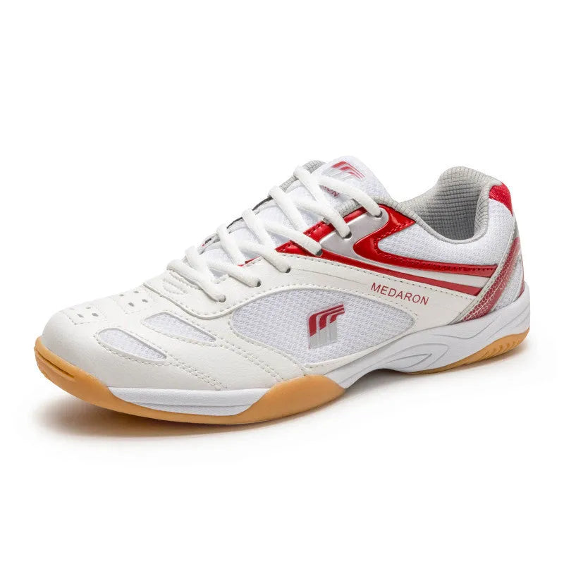 Table tennis training sneaker in white and blue with synthetic leather and mesh upper and lace-up front.
