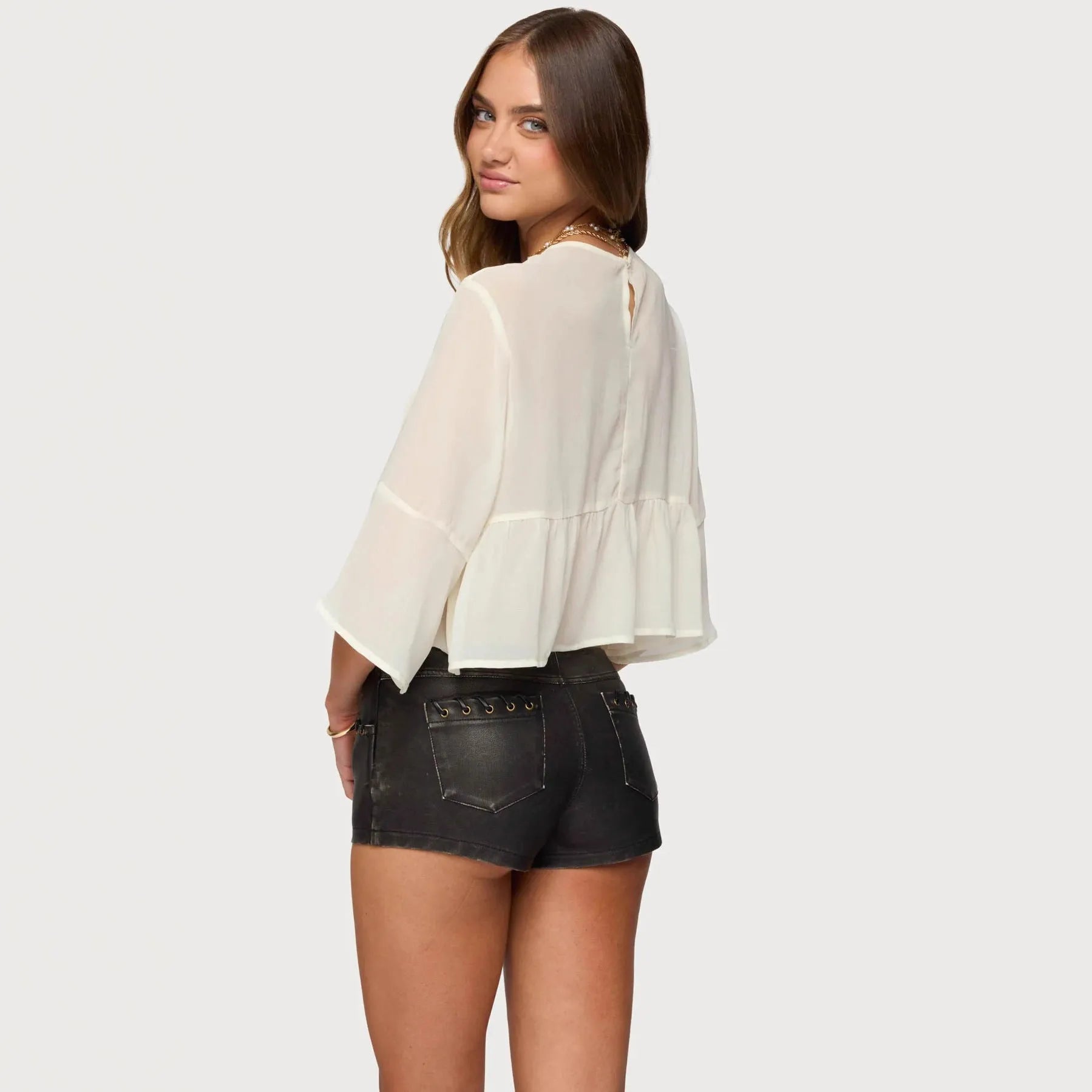 Creamy white women's chiffon t-shirt with batwing sleeves on hanger