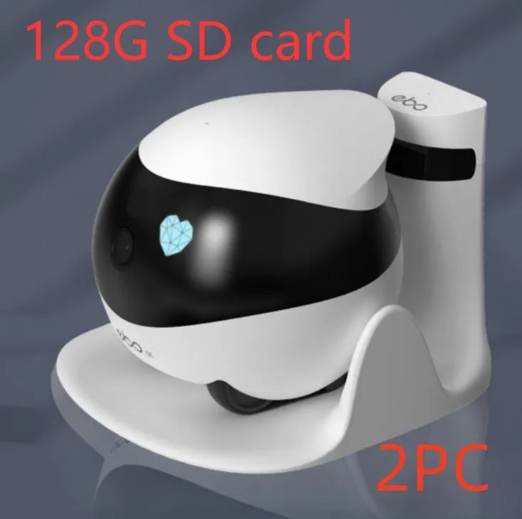 White compact mobile surveillance robot camera on a charging dock.