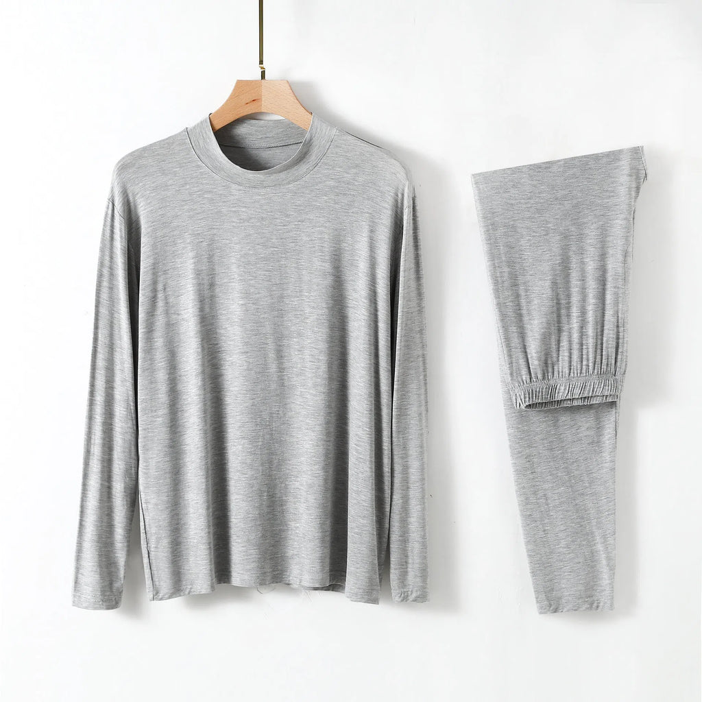 Men's modal pyjama set with semi-high neck and long pants in black, front view on model