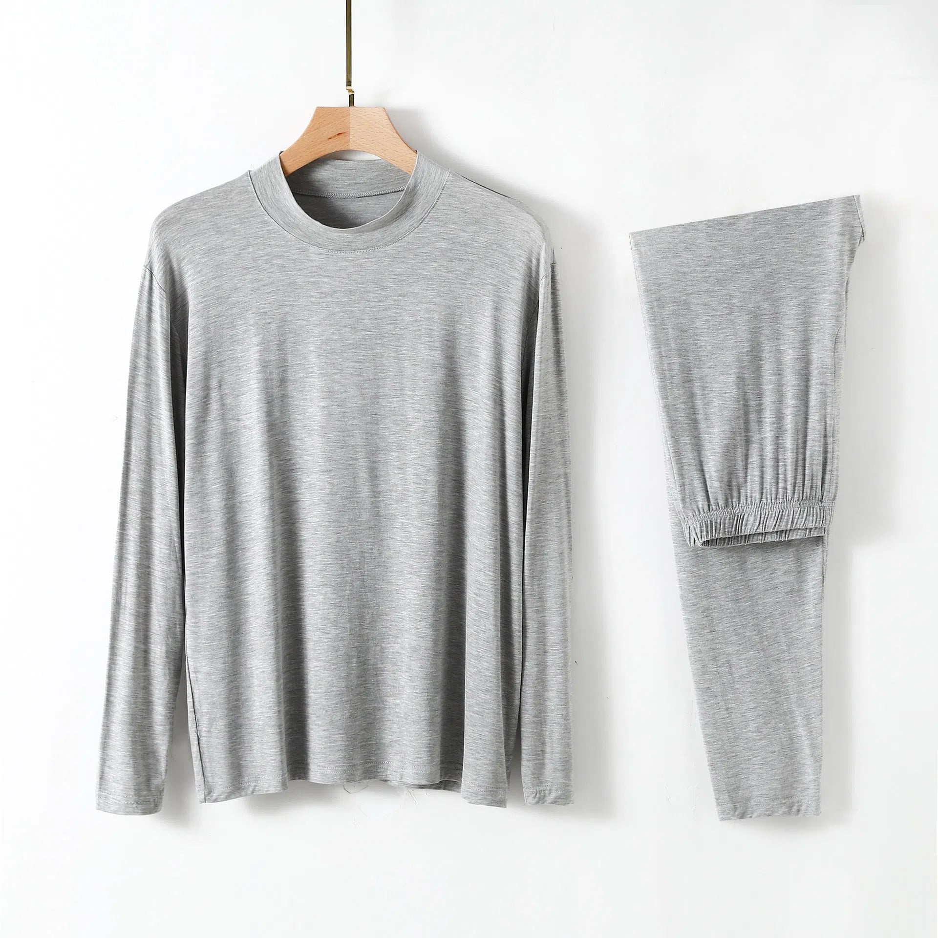 Men's modal pyjama set with semi-high neck and long pants in black, front view on model