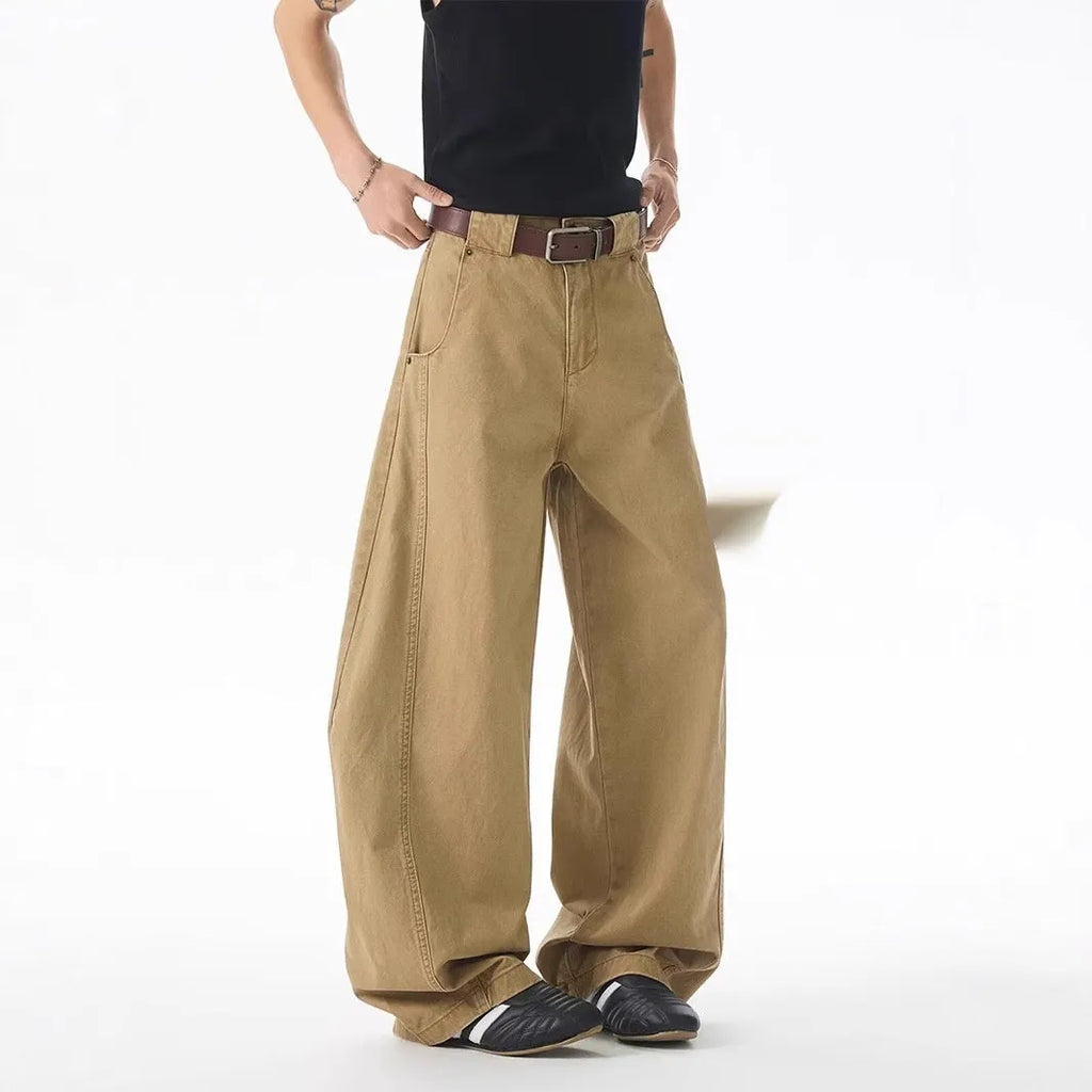 Men's brown loose-fit straight-leg casual jeans with a button fly on a mid waist.
