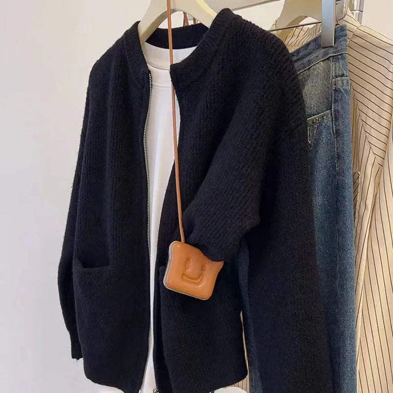 Soft beige viscose fibre sweater coat, a long-sleeve cardigan laid flat.