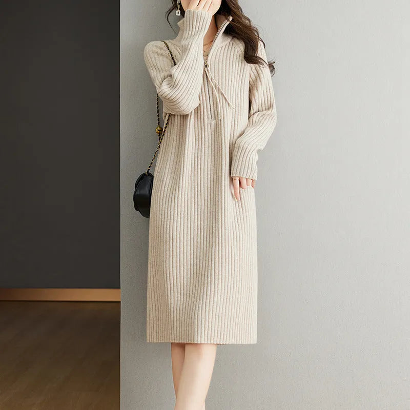 Beige half-zip woollen midi dress with long sleeves and a stand collar, laid flat.