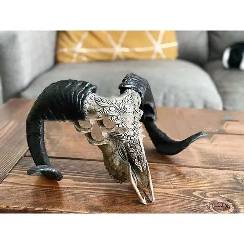 Grey resin horn wall decoration with bull head totem design mounted on a wall indoors