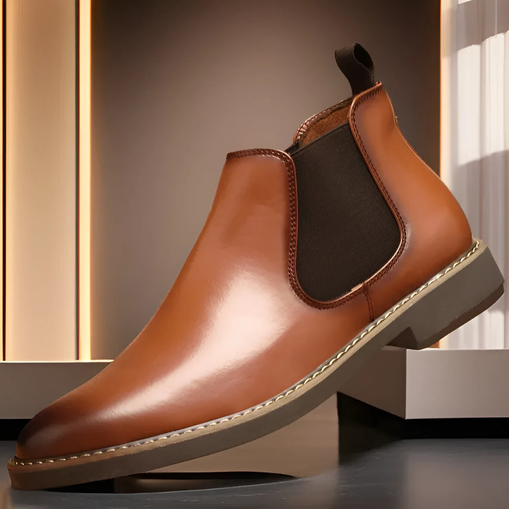 Men's black British-style mid-calf oversleeve boots with a flat square heel on a white background.