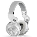Compact card-sized Bluetooth headset in black colour with head-mounted earpieces, shown on a white background.