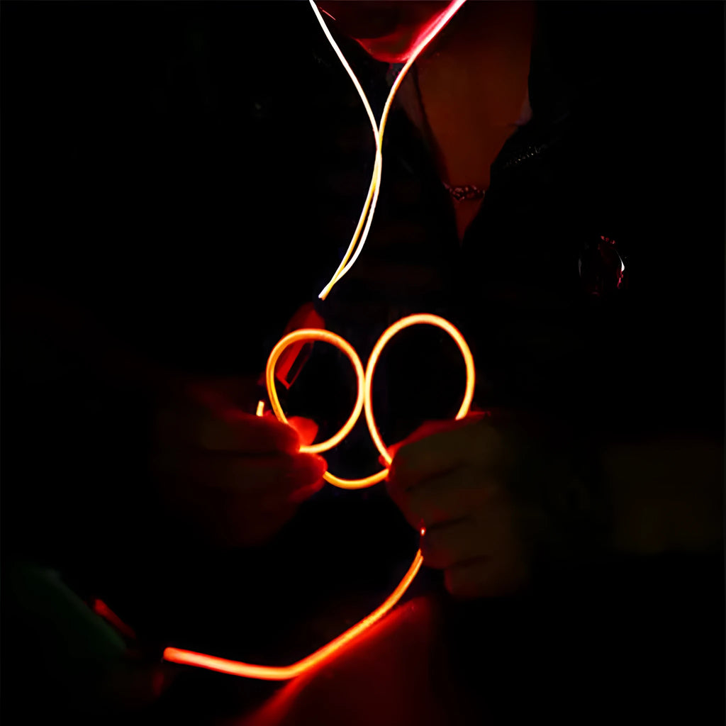 Blue LED light-up earphones with 3.5mm plug and remote control, flashing in sync with music.