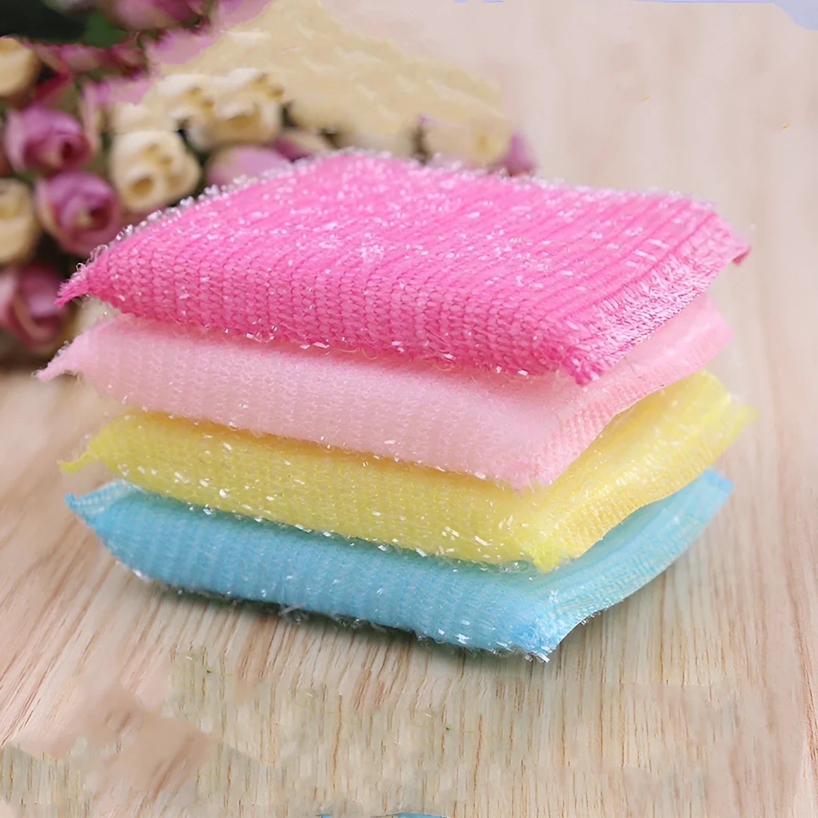 Pinstripe fabric dishwashing sponge mop in mixed macaron colours on a kitchen counter.
