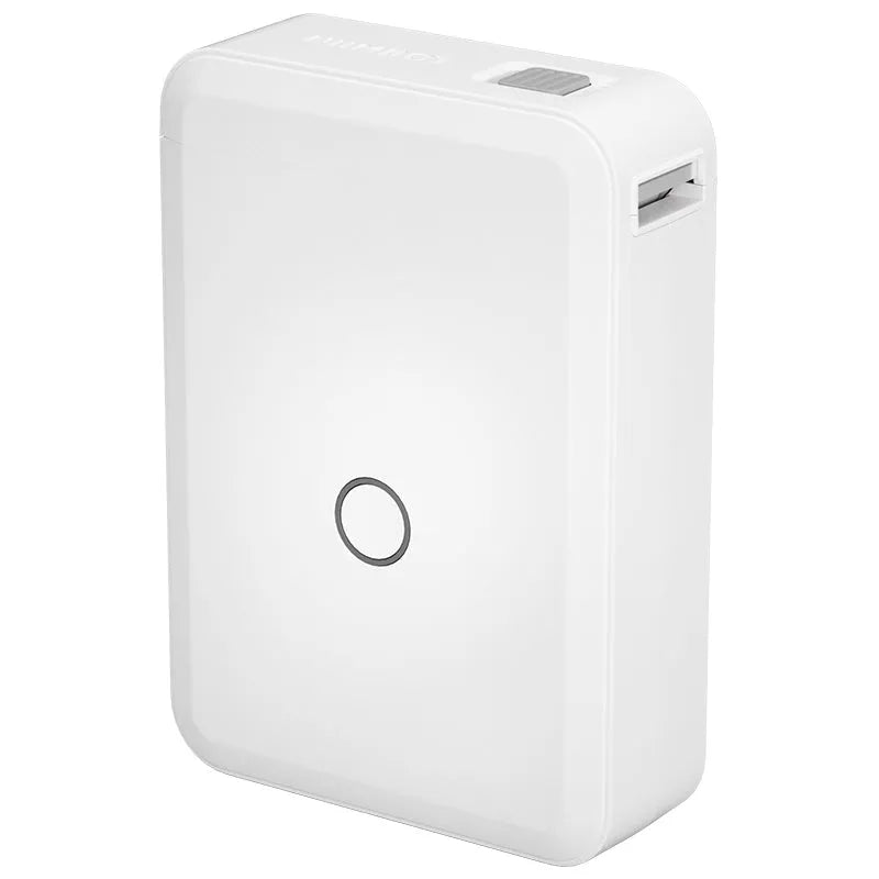White D110 compact thermal label printer on desk with label paper and USB cable