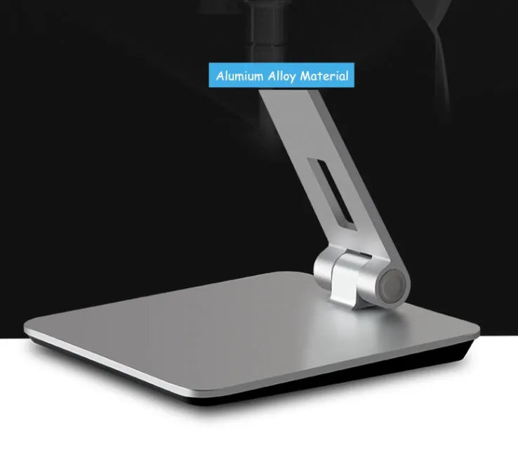 Silver foldable aluminium phone tablet holder on desk showing 360° rotation