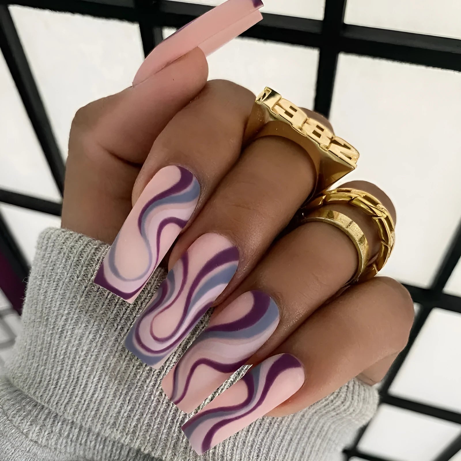 Pack of Ballet W067 wave line patterned nail stickers with pots of jelly glue on a pink background.