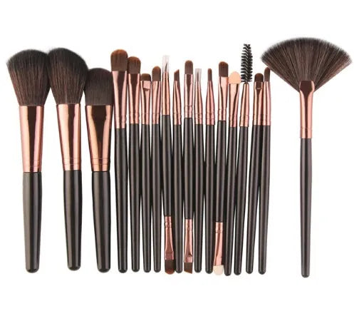 MAANGE 18-piece cosmetic brush set with fan-shaped makeup tools laid out on a table