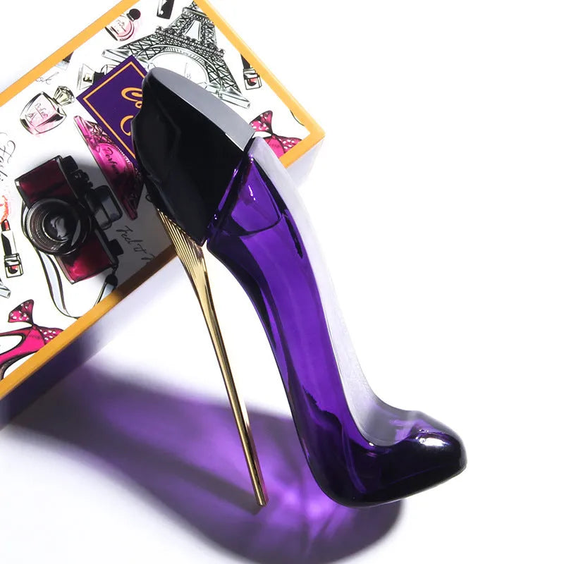 Red high heel shaped 40ml eau de toilette bottle with fruity floral notes including honey, rose and jasmine.