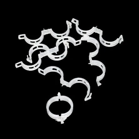 A pack of 50 green plastic garden plant grafting clips for securing tomato stems and tree twigs.
